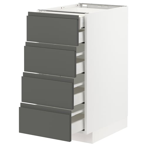 Het is een wit METOD keukenblok met vier grijze lades in een modern design en soepel glijdende lades.
