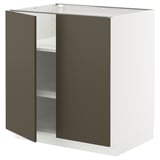Een witte METOD keukenkast met donkerbruine deuren. De kast is rechthoekig en heeft twee open planken.