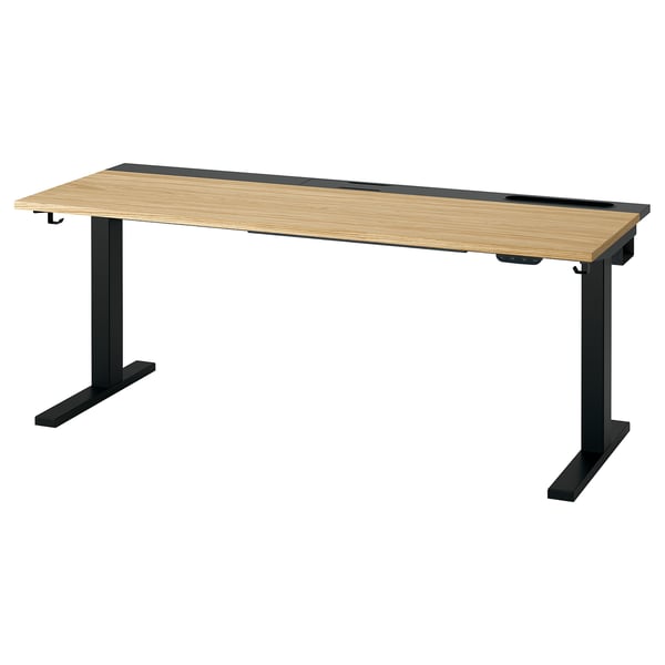 MITTZON zit-sta bureau: modern, zwart onderstel, houten blad. Ergonomisch ontwerp met dubbele motoren en kabelbeheer.