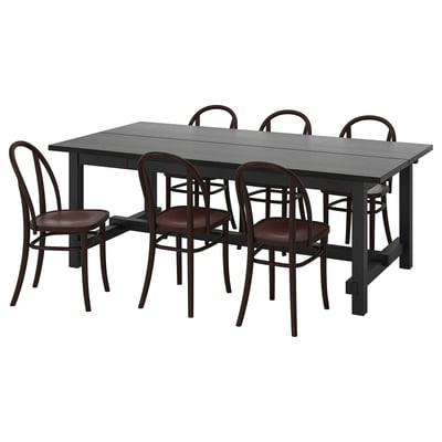 Zwarte houten 6-persoons eethoek met stoelen met gebogen rugleuning.