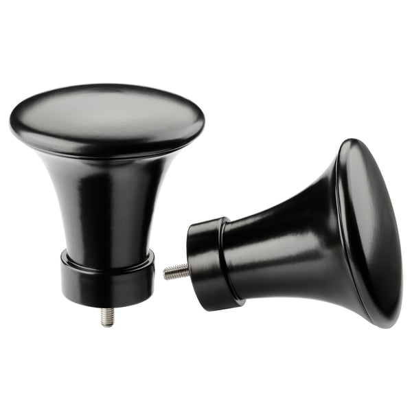 Twee zwarte metalen gordijnroede eindstukken in de vorm van trompetten, gestileerd met een strak design.