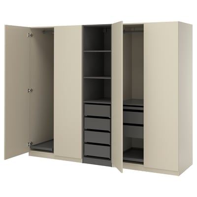 Een open beige ikea PAX kledingkast met planken en lades.