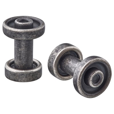 Twee ronde, grijze metalen kastknoppen met een strak design.