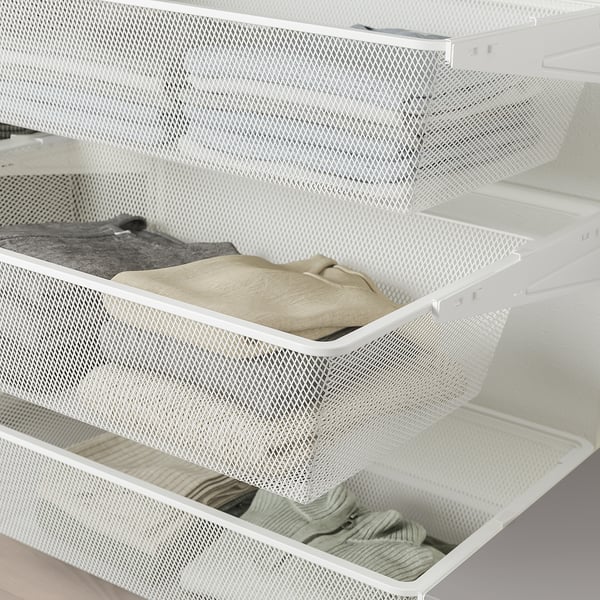 SKYTTA gaaslades bevatten opgevouwen kleding, onderdeel van het modulaire opbergsysteem.