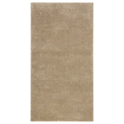 Een lichtbeige, rechthoekig vloerkleed genaamd STOENSE met een zachte, dikke pool, ideaal voor slaapkamers.