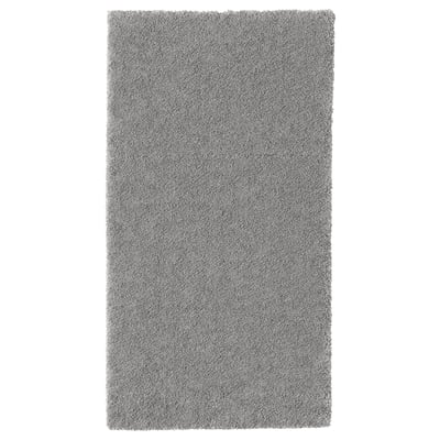 Grijs rechthoekig STOENSE vloerkleed met zachte, dikke pool voor comfort en geluiddemping.