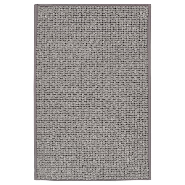 Grijze rechthoekige badmat, TOFTBO, zachte microvezel, getextureerde stippen, gerecyclede materialen.