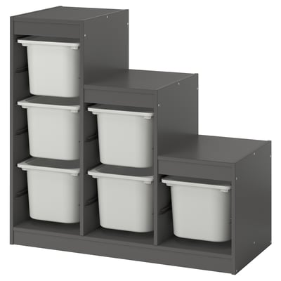 Ikea TROFAST: grijze modulaire opberger met zes witte plastic bakken, gerangschikt in twee gestapelde eenheden voor het organiseren van kinderartikelen.