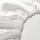 Fris, wit laken met elastische randen, met zachte stof van hoge kwaliteit.