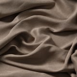 Zachte, gekreukte stof in neutrale tint; Dicht geweven zorgt voor warmte en privacy.