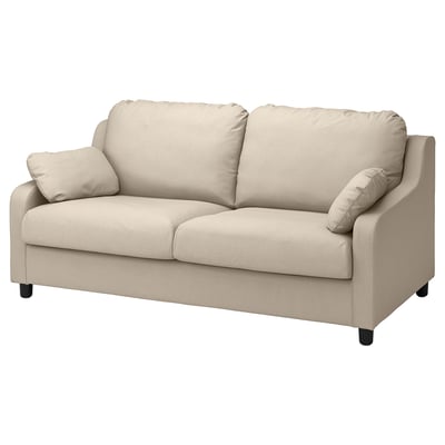 Een beige VINLIDEN bank met zachte stof, grote kussens en strakke poten.