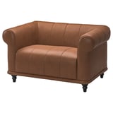 Bruin lederen VISKAFORS fauteuil, ronde vorm, getuft design.