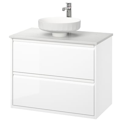 Modern white bathroom vanity with sleek design, round white sink, and two drawers.