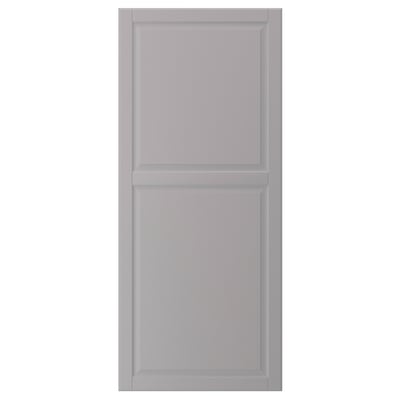 A grey BODBYN cabinet door with a smooth, rectangular shape and bevelled panels. It is simple and traditional in design.