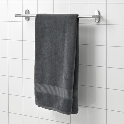 Grey FREDRIKSJÖN towel hangs on wall rack, soft cotton, rectangular.