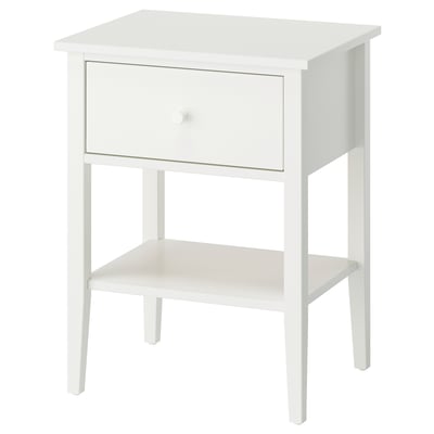 A white GULLABERG bedside table with a single drawer and an open shelf. It clean lines and elegant details, made of acrylic paint and fibreboard.