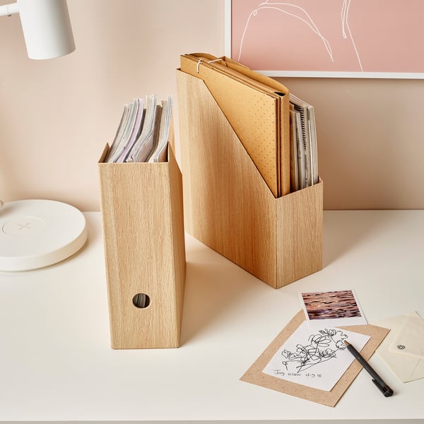 Two oak file organisers on desk, one with papers, other with notebook and files. Drawings and notes in front.