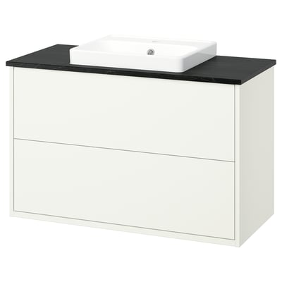 A white HAVBÄCK bathroom vanity with a black countertop and a square ceramic basin. It two drawers and modern, clean lines.