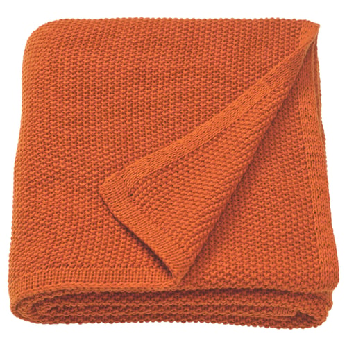 Bright orange, folded blanket with knit texture, rectangular shape.