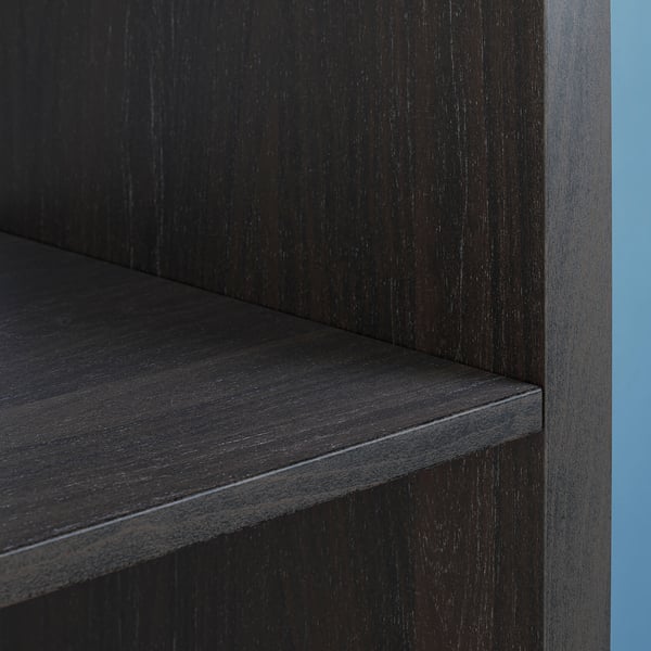 Black KALLAX shelving unit close-up, dark wood finish, corner detail.