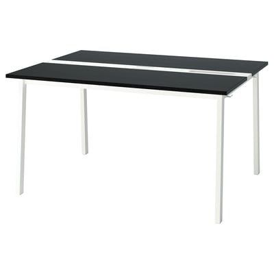 A MITTZON black and white rectangular conference table with metal legs.