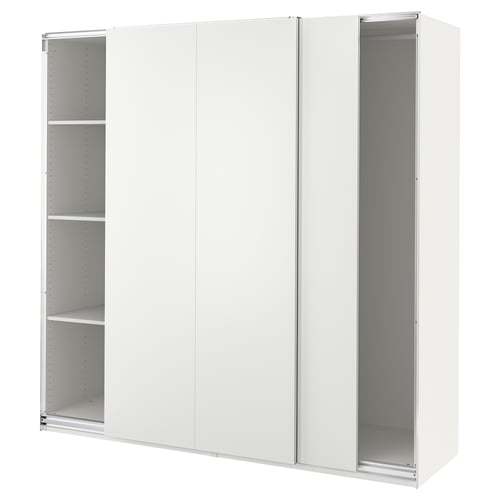 A white PAX wardrobe with sliding doors, featuring shelves inside.