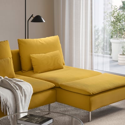 Living room with yellow SÖDERHAMN sectional sofa, remote, and blanket. Natural light through curtains.