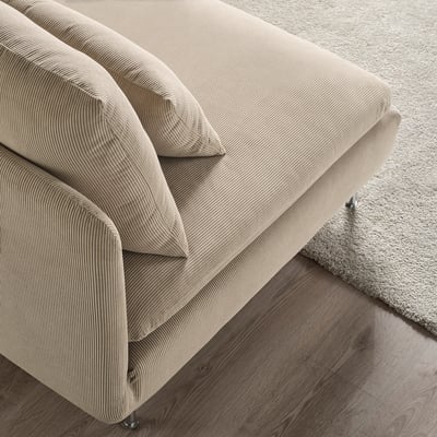 A modern, minimalist beige sofa with sleek lines and soft cushions, placed on a hardwood floor, enhancing its cosy and inviting aesthetic.