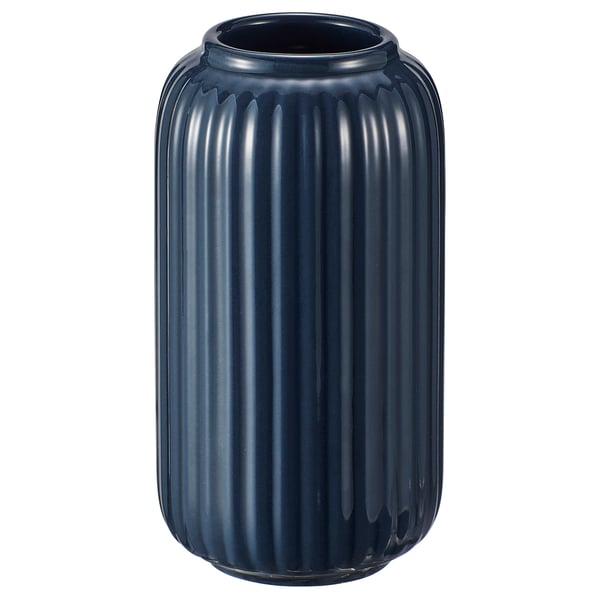 Depicts a blue STILREN vase made of stoneware with a coloured glaze, featuring a rounded cylinder shape and vertical ribbed design.