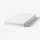 A white ÅBROTTEN mattress, rectangular, with a quilted pattern and three layers of foam for comfort and support.