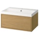 Modern bathroom unit: light oak, white basin, flat design, sleek handles.
