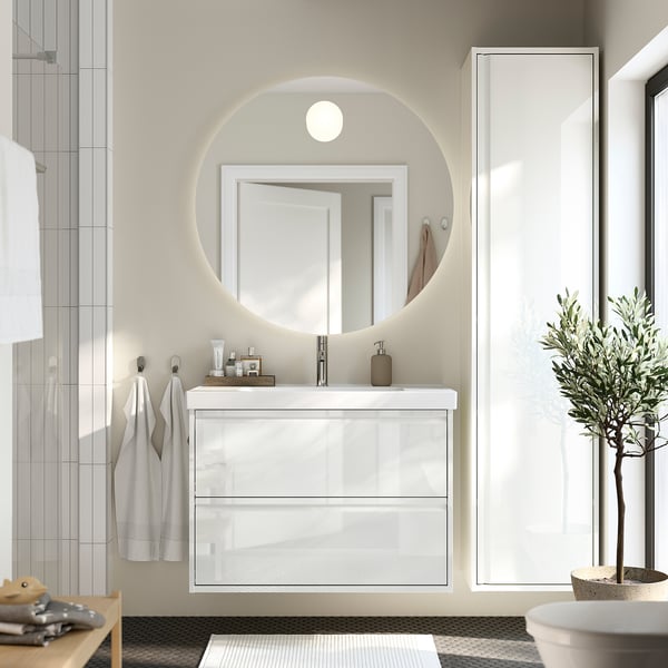 Modern ÄNGSJÖN bathroom vanity with two drawers, high-gloss design, ceramic basin, mirror with lighting.