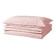 Pink cotton bedding set with folded duvet cover and pillows.