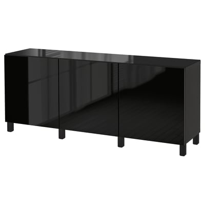 Black BESTÅ storage unit: sleek design, glossy glass top, three doors, sturdy wooden legs, modern aesthetic.