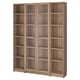 BILLY bookcase with glass doors in oak. Six compartments, adjustable shelves. Compact, modern design for homes.