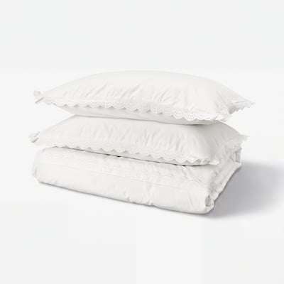 A white BIRGITTARÖNN duvet cover set with lace trims and a fabric tie closure, made of 100% cotton.