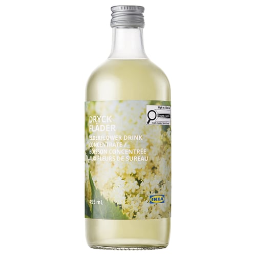 Bottle of ikea dryck flader elderflower drink concentrate. Clear glass, silver cap, white label with green and cream flowers.