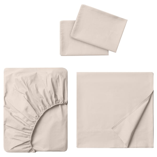 Three pieces of light beige bedding set: flat sheet, fitted sheet, and two pillowcases, all made of 100% cotton.