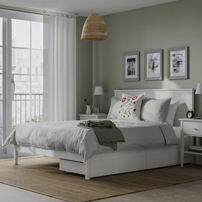 White GULLABERG bed with drawers, headboard, windows, and decor.
