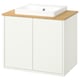 Havbaeck white bathroom cabinet with bamboo countertop and rectangular sink.