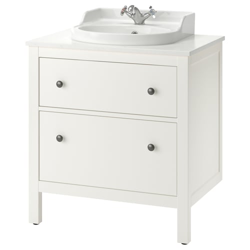 White HEMNES bathroom vanity with sink and knobs.
