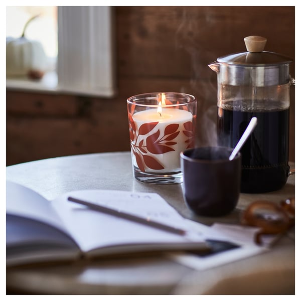 HÖSTAGILLE Scented candle in glass, Vanilla & apple clear glass/orange, 50 hr