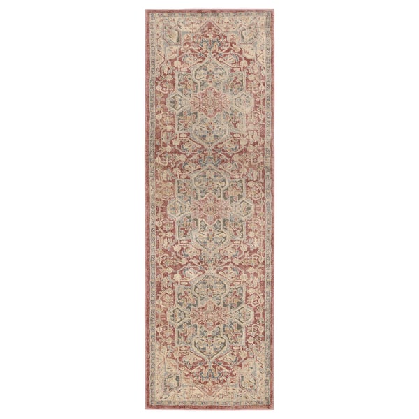 Vintage red and beige rug, rectangular, ornate floral patterns.