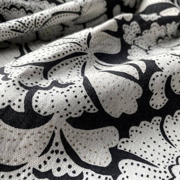 Black and white floral patterned shower curtain, made from textured cotton and jute blend.