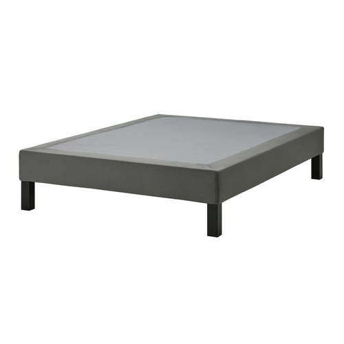 Grey rectangular bed base on black legs. Simple, modern design with upholstered fabric cover.