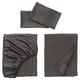 Three grey bed linens displayed: smoothly folded sheets and a pillowcase.