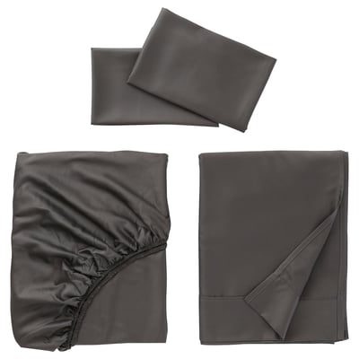Three grey bed linens displayed: smoothly folded sheets and a pillowcase.