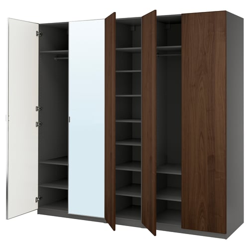 Ikea PAX wardrobe - tall, dark wooden storage unit with mirror and open shelves. Minimalist design, modern, functional.
