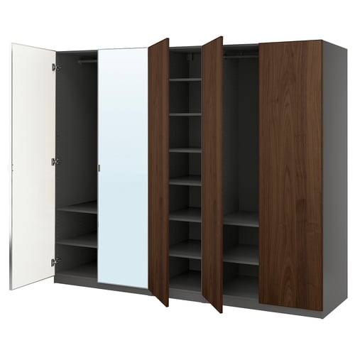 An open PAX wardrobe in dark wood and white, featuring shelves and a mirror.