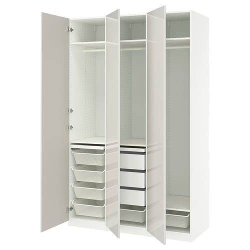 White PAX wardrobe with open doors, shelves, drawers, and baskets.